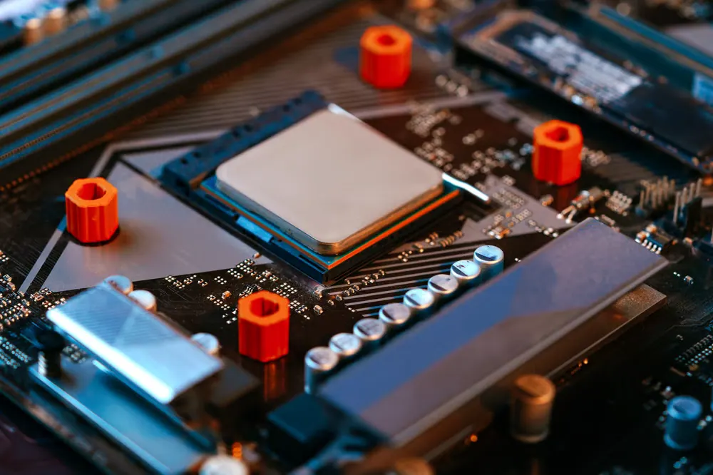 Close-up of a phone logic board during micro-soldering repair